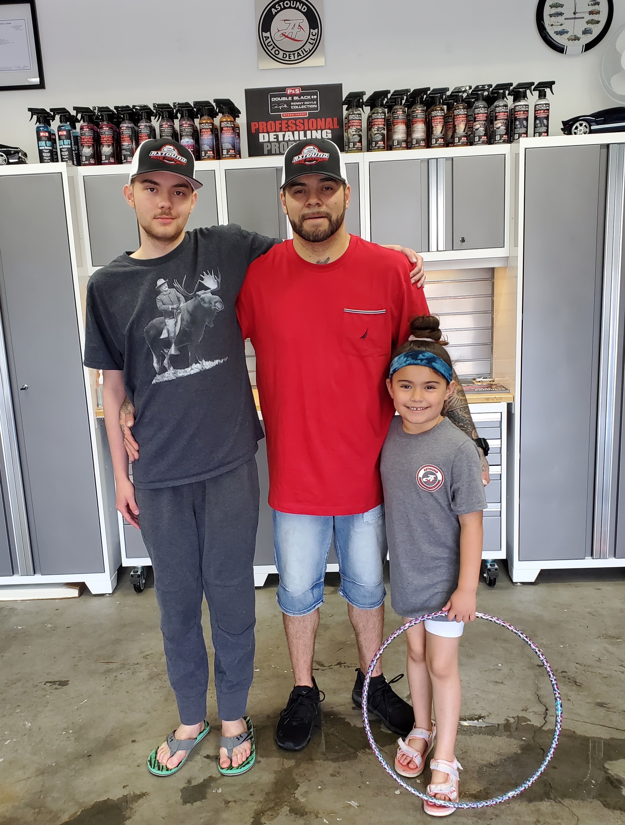 Jersain with family in the Astound Auto Detail shop